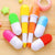 Colorful Capsule-Shaped Writing Pen set featuring playful capsule-style design for creative writing.