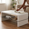 Arch High Gloss Coffee Table White with a glass shelf, person enjoying coffee while reading a book.