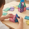 Child playing with 58-Piece Magnetic Diamond Building Blocks to create colorful geometric structures.