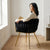 Braided Velvet Plush Fabric Dining Chair with luxurious design and elegant woman relaxing in a modern living room setting.