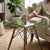 Shelf Bent Clear Glass Side Table Set featuring transparent top and wooden legs in a modern living room.
