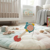 Elephant Rattle Toy on a soft play mat in a cozy nursery setting, perfect for sensory play and interaction.