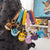 Color Monster Creature Sphere Keychain with Wrist Strap featuring colorful character charms on a backpack.