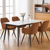 Senna Velvet Padded Dining Chair at a modern dining table with floral centerpiece and stylish decor.