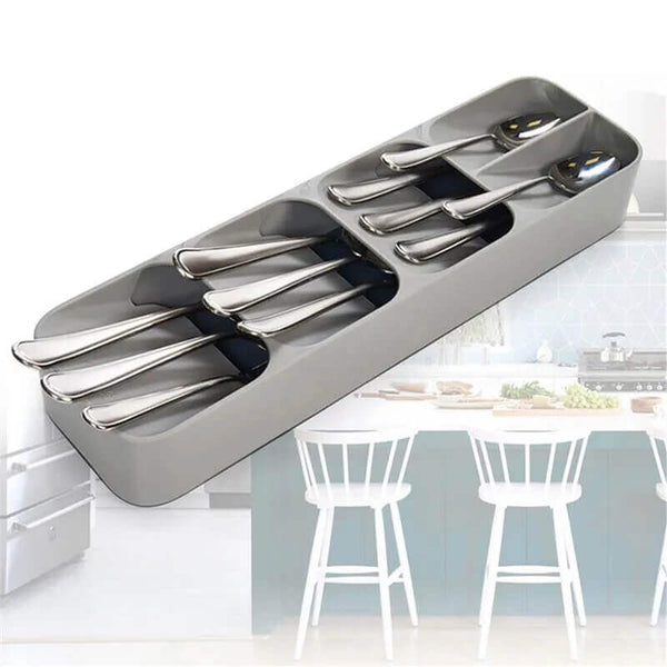 Compact Drawer Cutlery Spoons Knives Holder and Organizer with stainless steel utensils in modern kitchen.