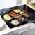 5 in 1 Magic Non Stick Frying Pan with compartments for eggs, bacon, sausage, vegetables, and more.