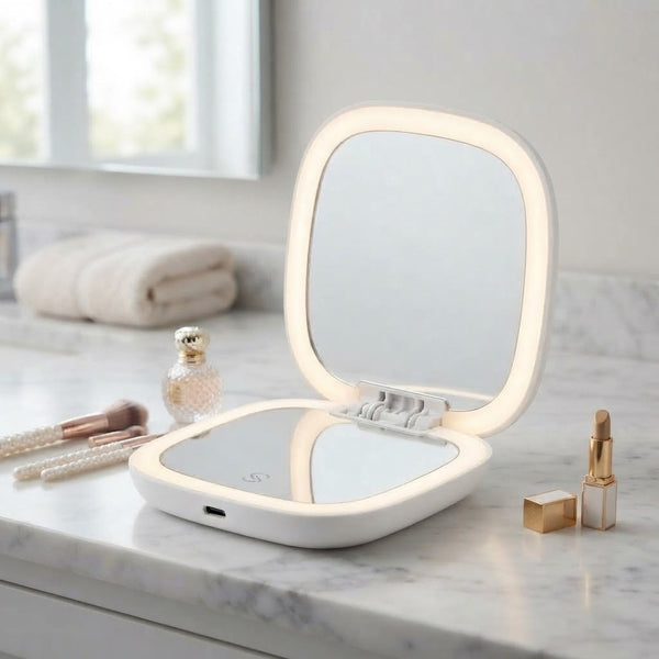 Portable Rechargeable Seashell LED Mirror on a vanity table with integrated LED lighting for grooming.