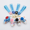 3D Silicone Astronaut Keychain collection featuring colorful keychains with cute astronaut figures and straps.