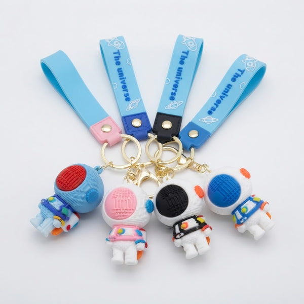 3D Silicone Astronaut Keychain collection featuring colorful keychains with cute astronaut figures and straps.