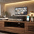 5MP 5-in-1 32-Channel Hybrid Digital Video Recorder on a wooden TV stand with modern decor.