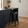 Counter Bar Chair positioned at a kitchen island with a modern design and durable metal frame.
