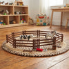 Farm Assembly Animal Fence Building Play Set with toy animals and fence on a textured rug.