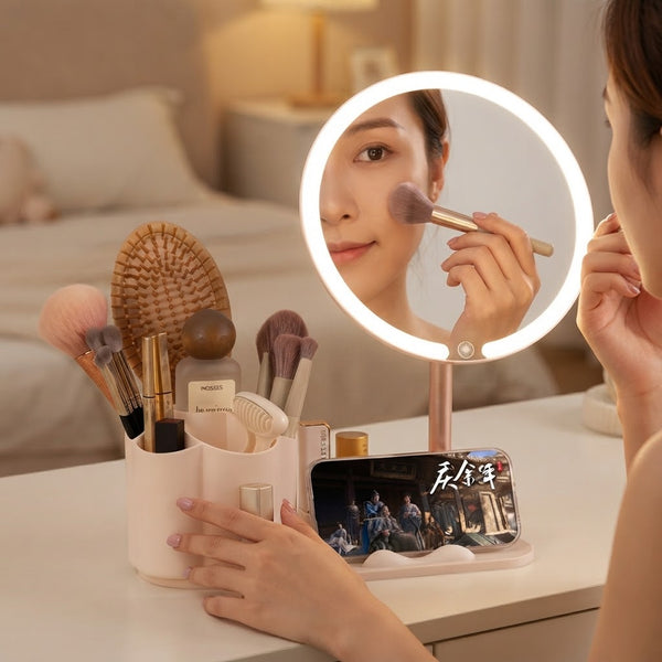 LED Makeup Mirror with Rotating Cosmetic Organizer featuring a user applying makeup and using a phone stand.