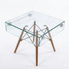 Shelf Bent Clear Glass Side Table Set showcasing a modern transparent design with wooden legs and metal accents.