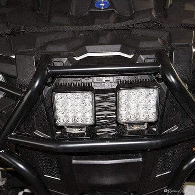 48W Portable LED Spot Light mounted on a rugged vehicle, designed for powerful illumination and durability in outdoor settings.