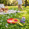Bubble Wand and Tray Set on grass with colorful bubbles, a picnic basket, and a bottle of bubble solution.
