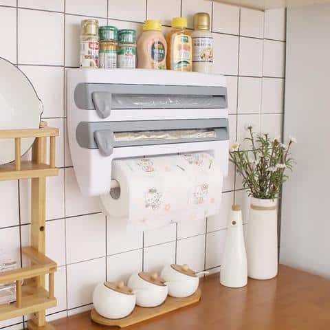 4 In 1 Wall Mounted Paper Towel Foil Wrap Dispenser with towels and condiments on a kitchen wall.