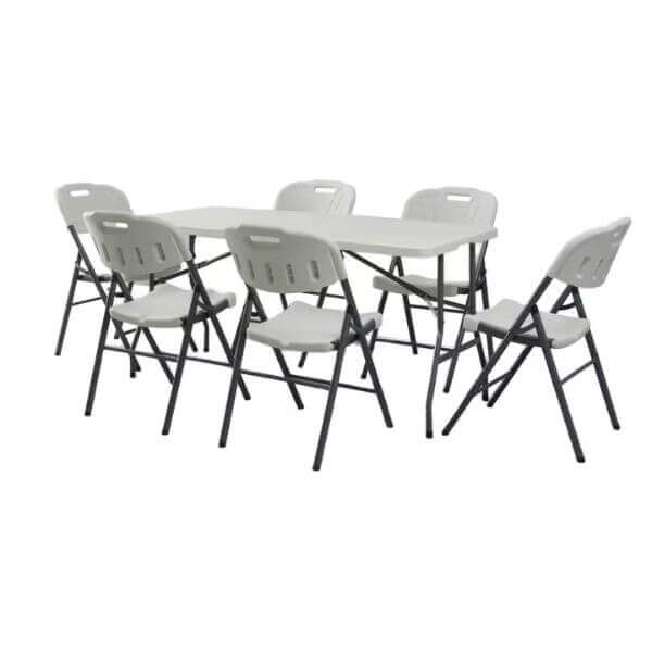 Summit Foldable Table with six folding chairs arranged around it, ideal for events and gatherings.