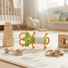 Lobster Accordion Musical Baby Toy on a play mat surrounded by wooden blocks and other baby toys.