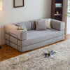 Modern Space-Saving Convertible Sofa Bed with plush cushions and seating, ideal for small living spaces.