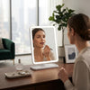 Woman applying makeup using Rectangular LED Desktop Makeup Mirror with Touch Control in a modern, well-lit setting.