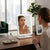 Woman applying makeup using Rectangular LED Desktop Makeup Mirror with Touch Control in a modern, well-lit setting.
