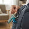 3D Cartoon Dinosaur Keychain attached to a backpack, featuring a playful dinosaur design.