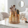 Clear Amber Rotating Makeup Brush Storage Bucket with makeup brushes and cosmetics elegantly organized.
