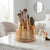 Clear Amber Rotating Makeup Brush Storage Bucket with makeup brushes and cosmetics elegantly organized.