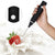 Handheld USB Milk Frother mixing milk with a splash and a strawberry, perfect for making frothy drinks.