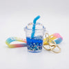 Floating Liquid Bubble Tea Cup Keychain with blue liquid and playful design, perfect for bags and keys.
