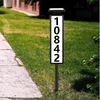 LED House Number Kit displaying illuminated house number 10842 in a landscaped yard.