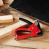 GS Manual Nail Staple Gun on a wooden surface with wooden blocks for DIY and repairs