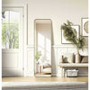 Full Length Leaner Floor Mirror displayed in a modern interior with plants and decor, enhancing the room's brightness.