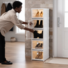 Person organizing footwear in a Transparent Foldable Shoe Rack 5 Tiers, showcasing its stylish and practical design.