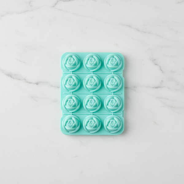 Flower-Shaped Silicone Ice Cube Tray displaying 12 flower-shaped ice molds on a marble surface.