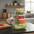 Deluxe 5-Piece Stackable Airtight Food Container Set filled with fresh vegetables on a kitchen countertop.