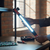 Person holding a Rechargeable Magnetic LED Work Light Bar while working on a project in a dimly lit room.