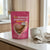 Assisted Pregnancy Granules packaging next to a cup on a kitchen counter.