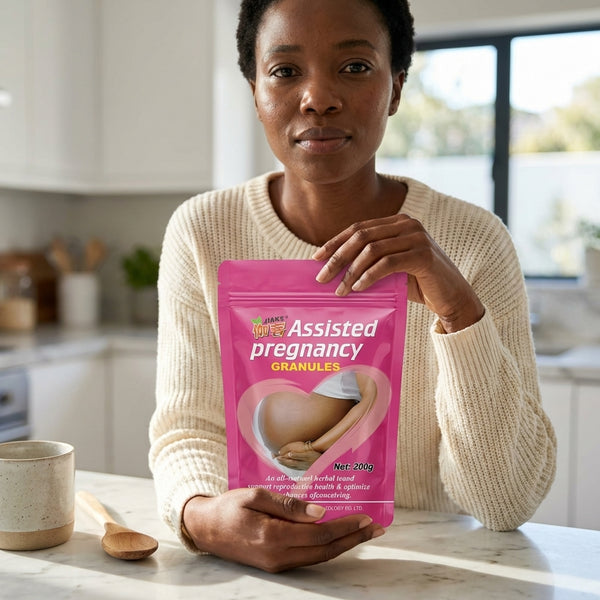 Woman holding Assisted Pregnancy Granules product in a kitchen setting, promoting reproductive health.