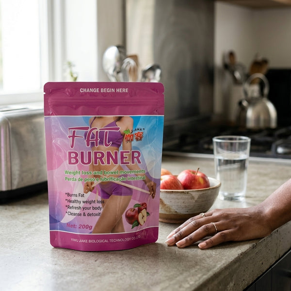 Fat Burner Powder on kitchen counter with apples and a glass of water, promoting weight loss and energy support.