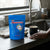 Natural Prostate Health Tea packaging on a kitchen countertop next to a steaming cup.