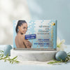 Brightening Facial and Body Soap packaging featuring a woman showcasing clear skin with anti-aging benefits.
