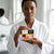 Eczema And Psoriasis Soap held by a woman in a white robe, showcasing its soothing benefits for irritated skin.