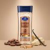Dr. Davey Cocoa Butter Glow Body Oil Gel in a transparent bottle with cocoa beans and vanilla around it.