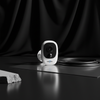 Security Camera 1080P HD Wireless WiFi Rechargeable Battery positioned on a sleek surface with a black background.