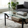 Modern Adjustable 1-Tier or 2-Tier Glass and Wood Coffee Table in a chic living room setting with a cozy aesthetic.