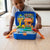 Child playing with Gas Station Simulation Backpack Role Playing Toy, featuring a foldable gas station and cars.