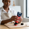Acrylic Paint 75ml - Scarlet being squeezed from a tube by a woman in an apron, ready for artistic use.