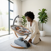 Baby Swings for Infants to Toddler, a serene swing with a baby peacefully resting while a parent adjusts settings.